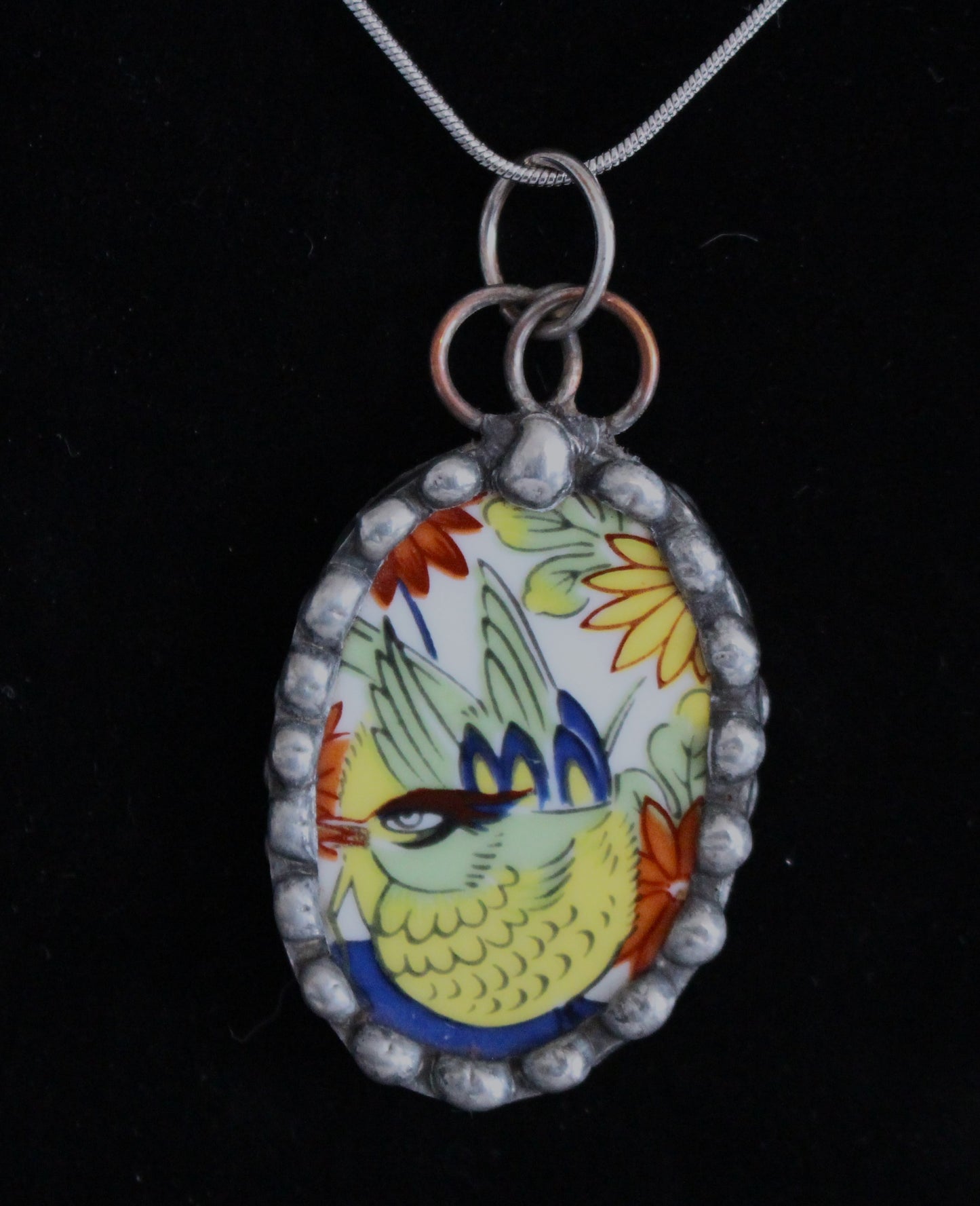 Brightly Colored Bird Pendant With Oriental Flair