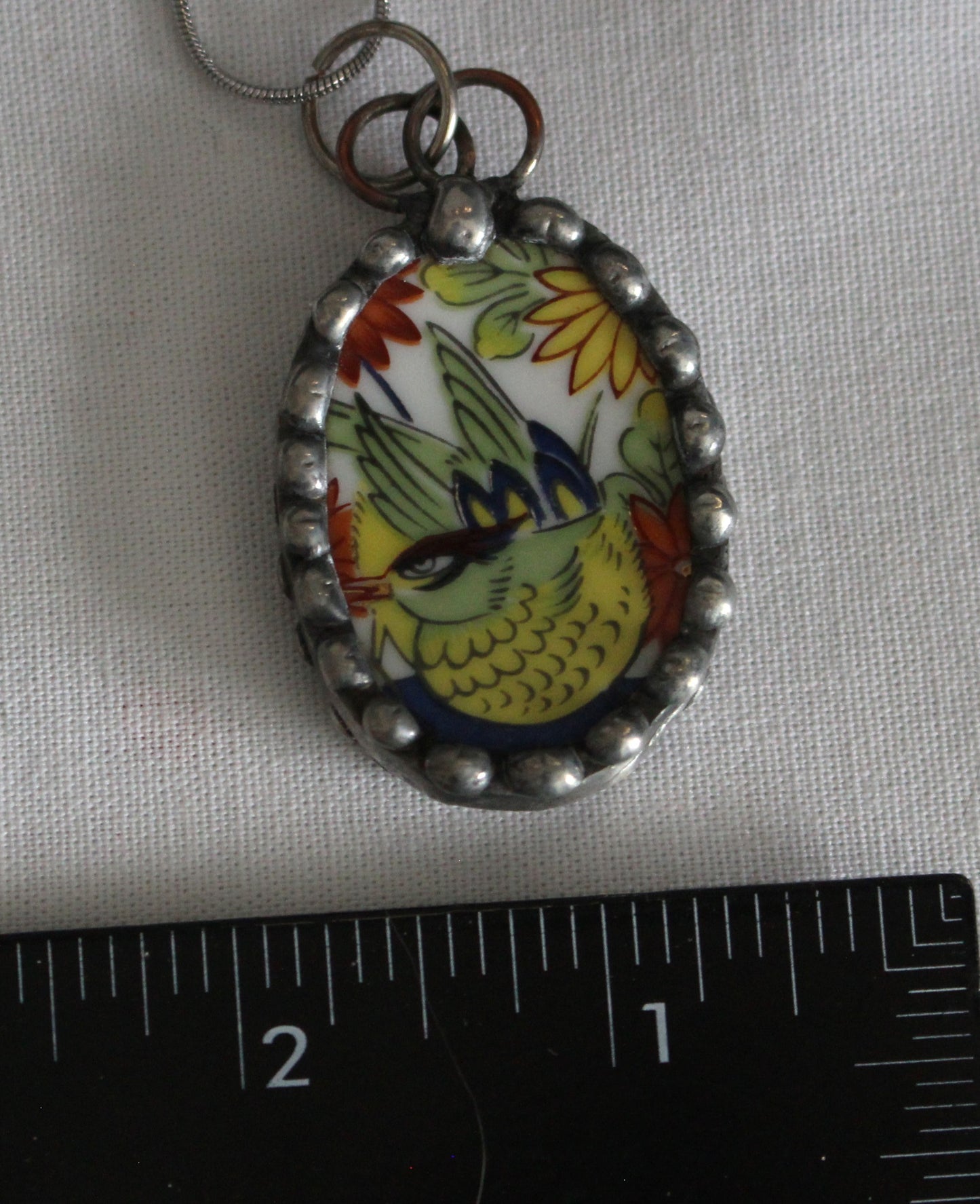 Brightly Colored Bird Pendant With Oriental Flair