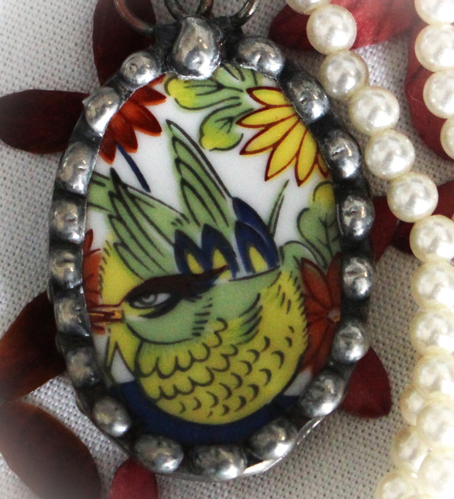 Brightly Colored Bird Pendant With Oriental Flair