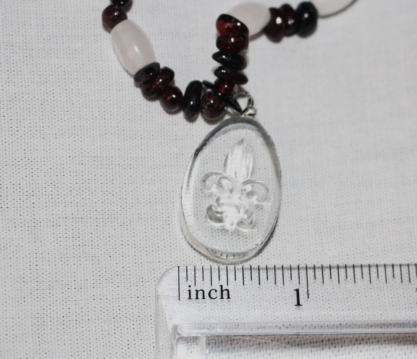 Fleur De Lis Pendant with Garnet